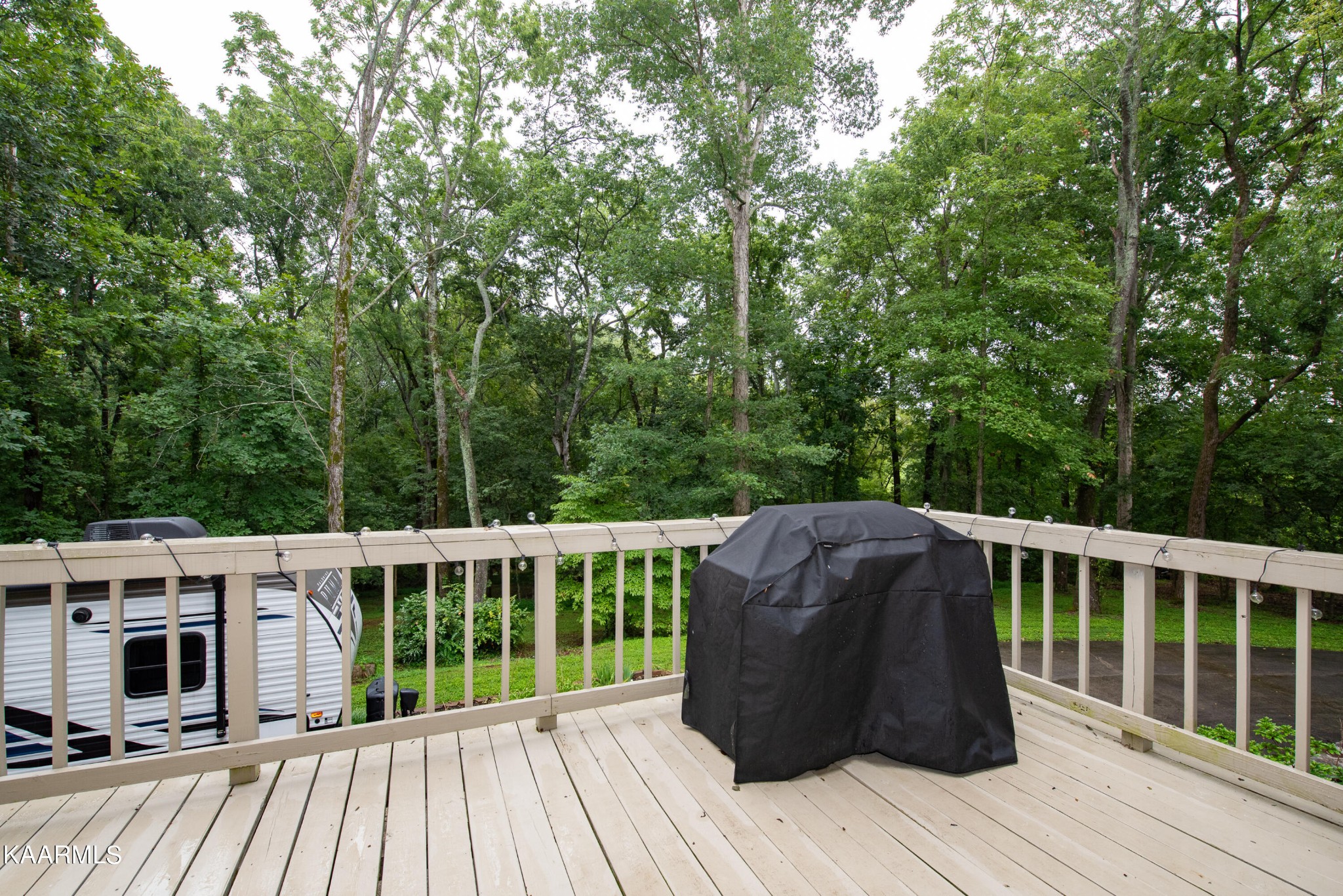 125 Lakeview Estates Road Vonore, TN 37885 - Photo 31 of 46 a view of a wooden deck and a yard