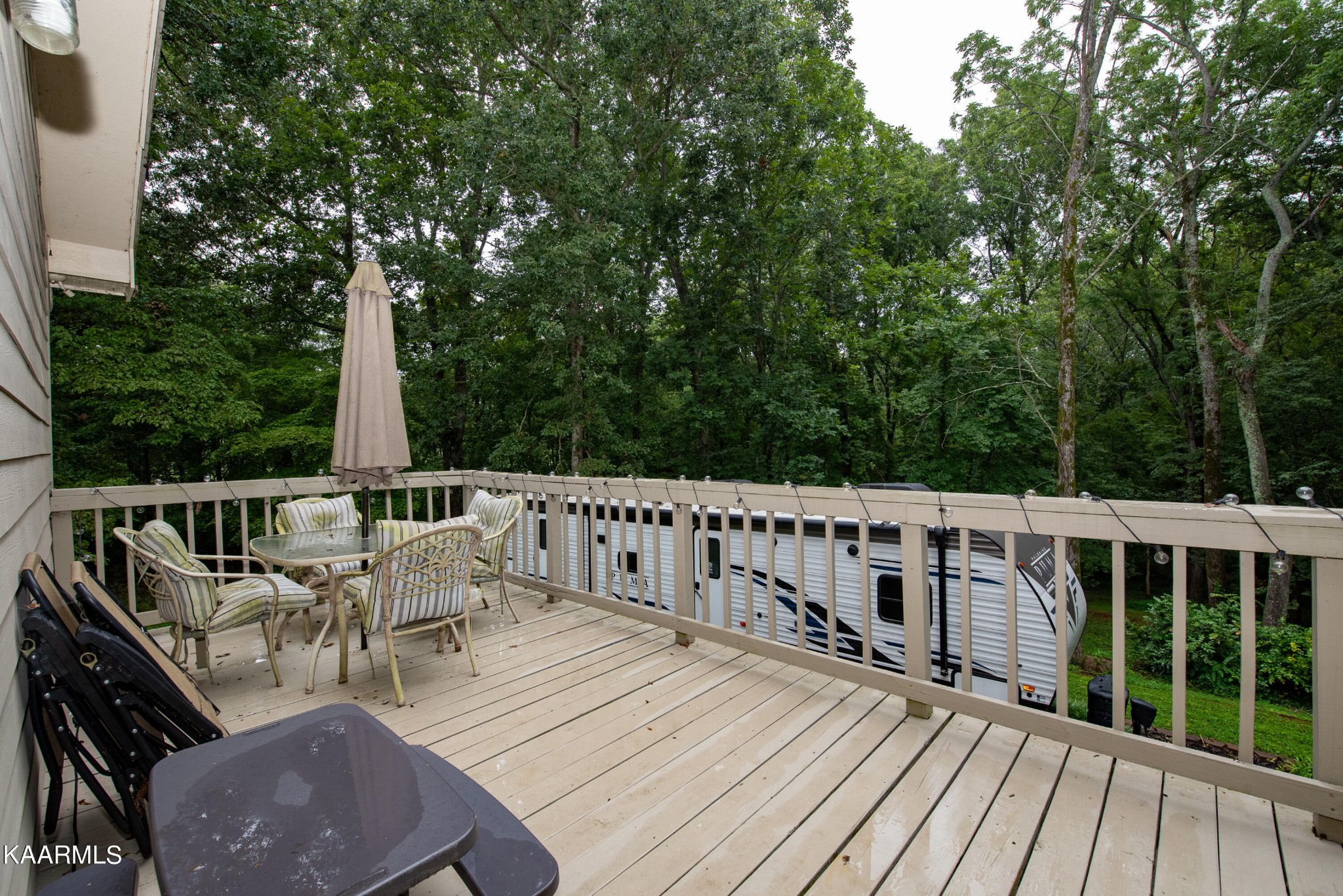 125 Lakeview Estates Road Vonore, TN 37885 - Photo 32 of 46 a view of balcony with furniture and trees