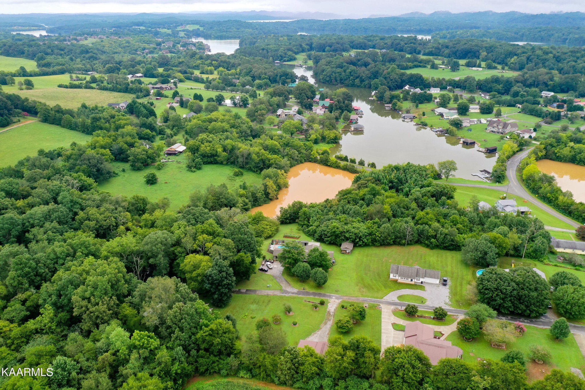 125 Lakeview Estates Road Vonore, TN 37885 - Photo 43 of 46 an aerial view of lake residential house with outdoor space and trees all around
