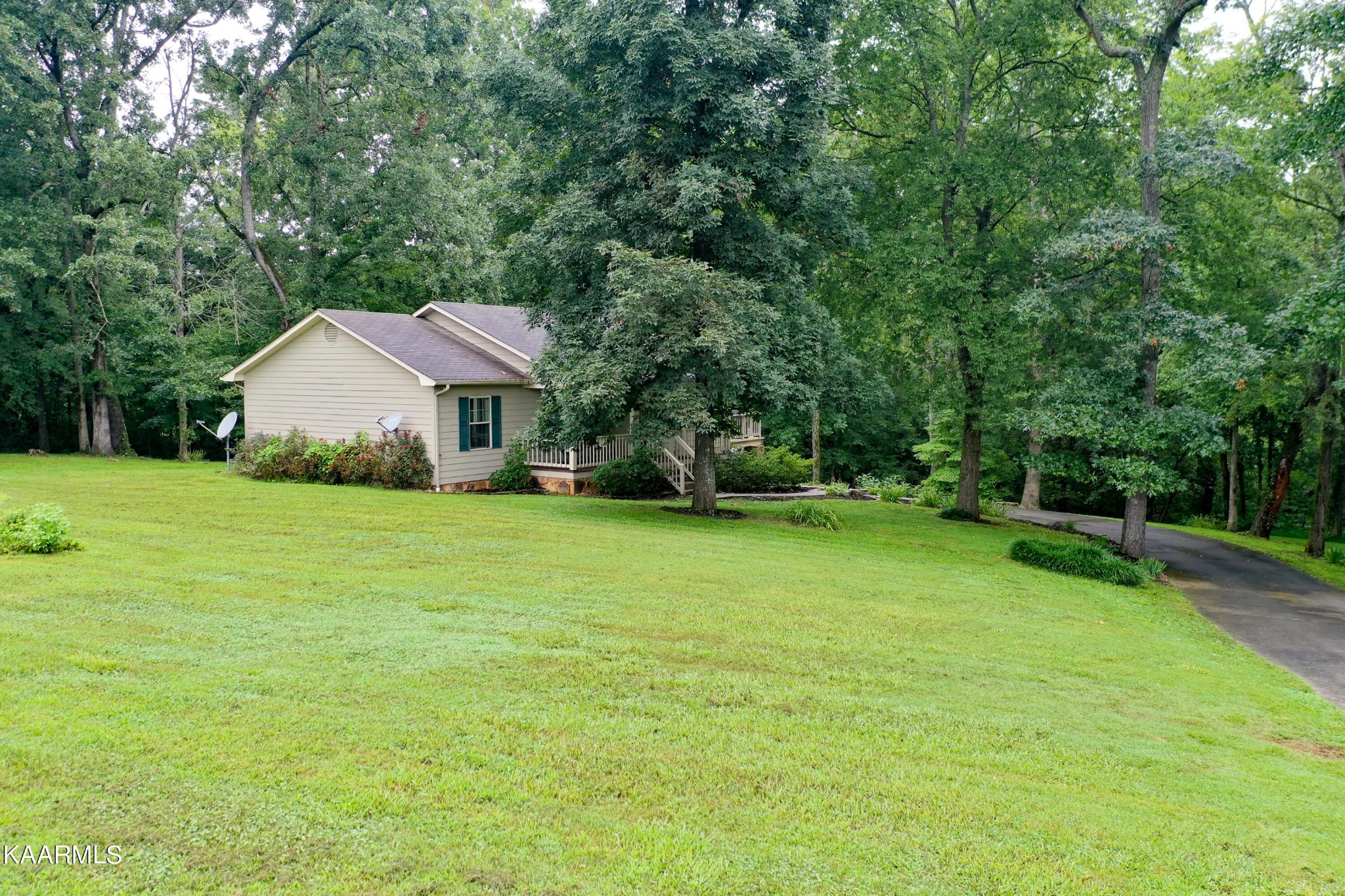 125 Lakeview Estates Road Vonore, TN 37885 - Photo 45 of 46 a front view of a house with garden