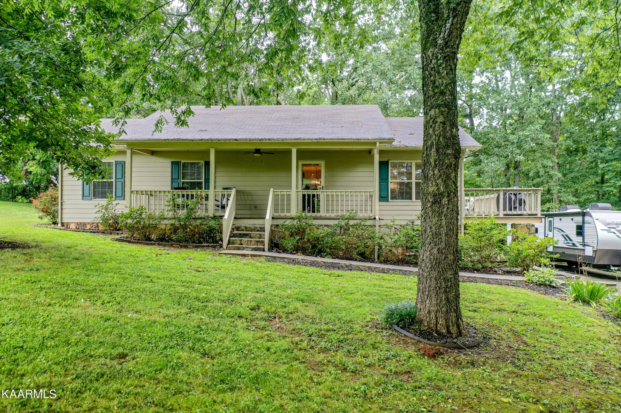 125 Lakeview Estates Road Vonore, TN 37885 - Photo 46 of 46 a view of a house with backyard garden and trees