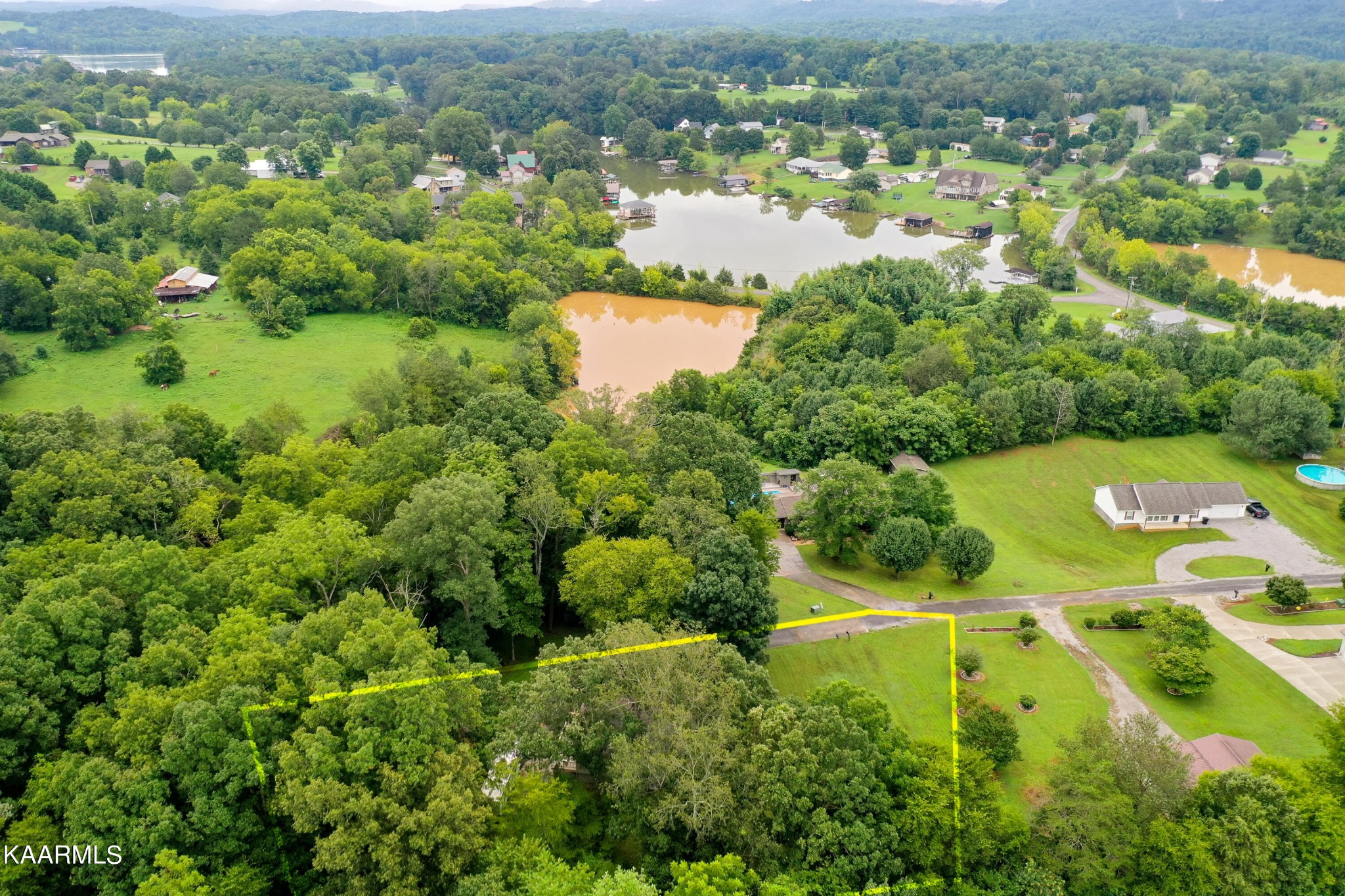 125 Lakeview Estates Road Vonore, TN 37885 - Photo 6 of 46 an aerial view of residential houses with outdoor space and trees