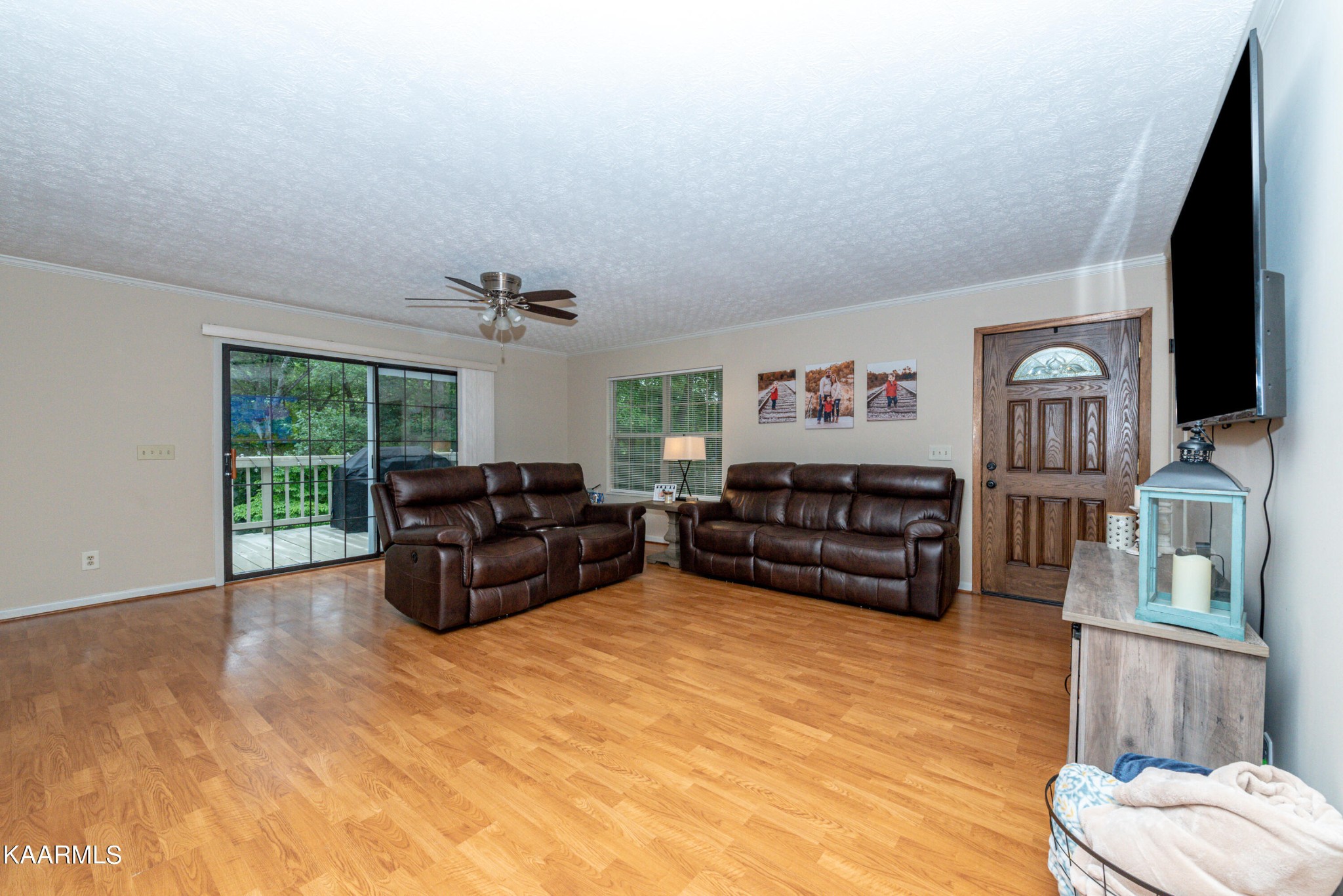 125 Lakeview Estates Road Vonore, TN 37885 - Photo 8 of 46 a living room with furniture flat screen tv and a large window