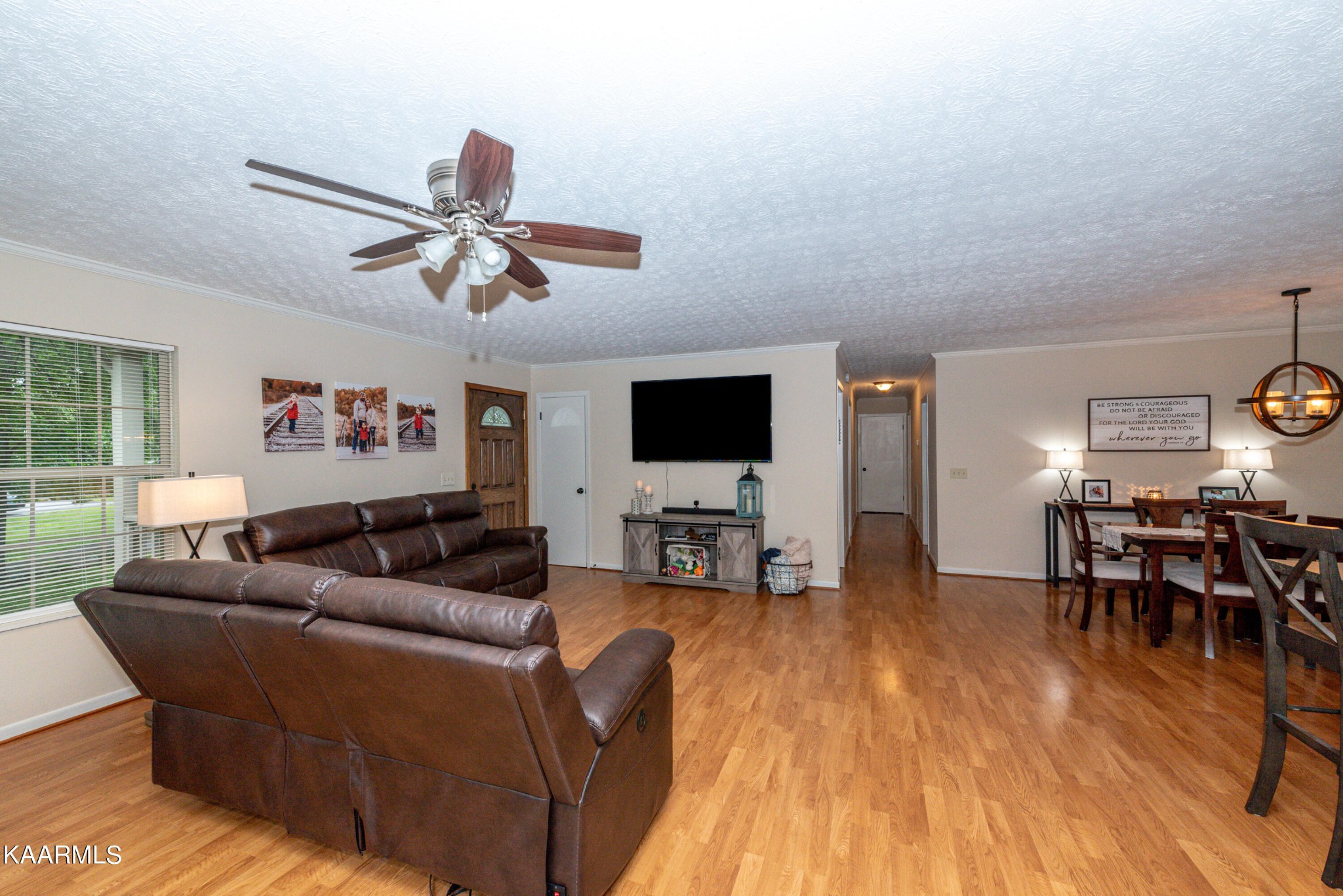 125 Lakeview Estates Road Vonore, TN 37885 - Photo 9 of 46 a living room with furniture a flat screen tv and a large window