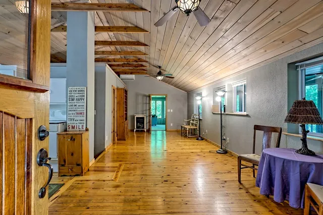 a view of kitchen and dining room with wooden floor
