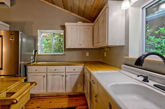 a view of a kitchen with furniture and a window