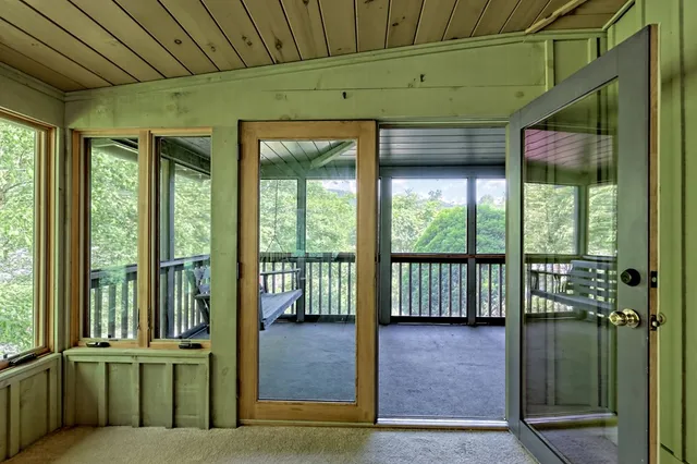 a view of a room that has a large window