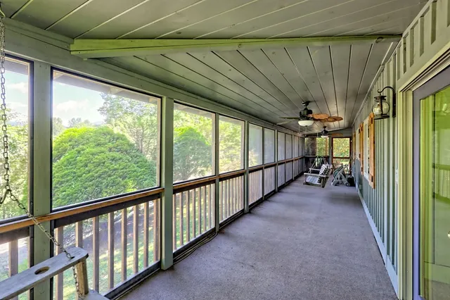a view of two chairs in the balcony