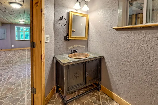 a view of a big room with wooden walls