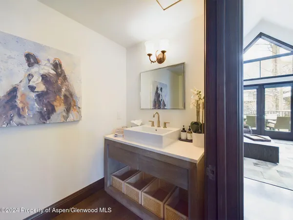 a bathroom with a tub a toilet and sink