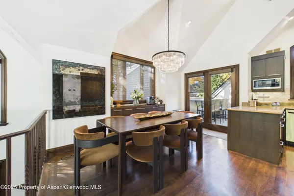 a spacious bedroom with a bed a couch and a window