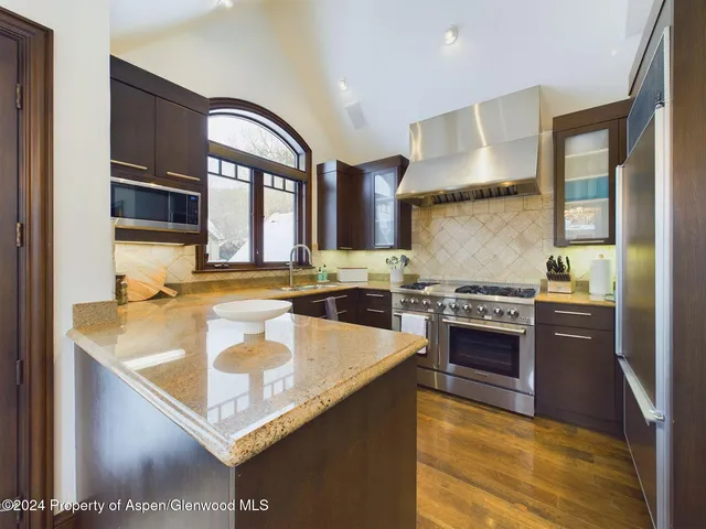 a spacious bedroom with a bed and a couch