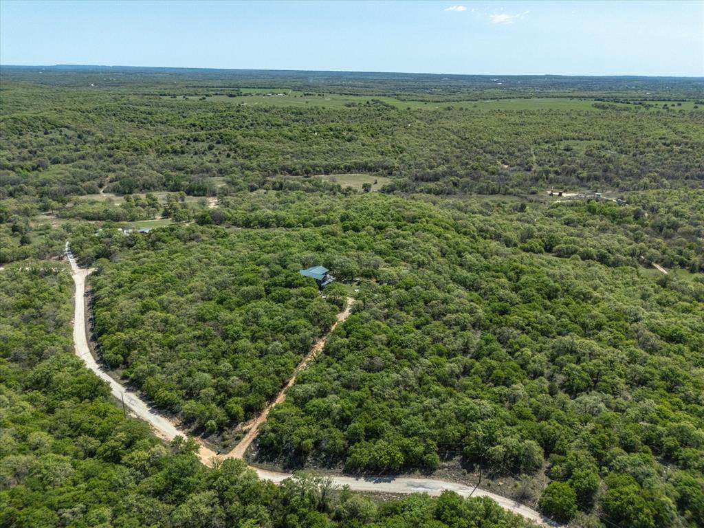 900 Old Spring Road Nocona, TX 76255 - Photo 14 of 27 an aerial view of residential houses with outdoor space and trees