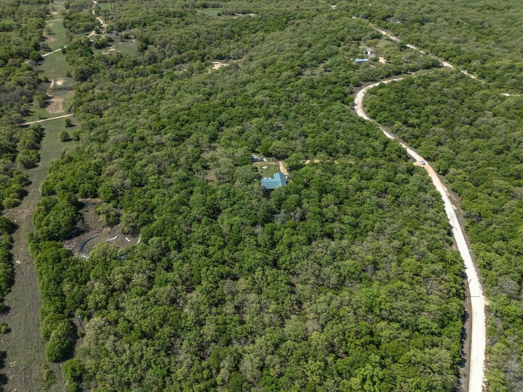 900 Old Spring Road Nocona, TX 76255 - Photo 10 of 27 a view of a forest with a houses
