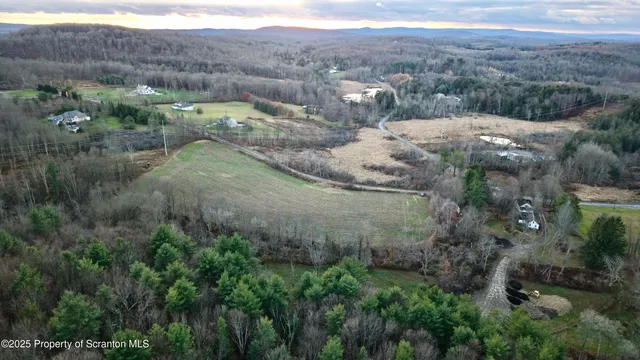 a view of a town with mountains in the background