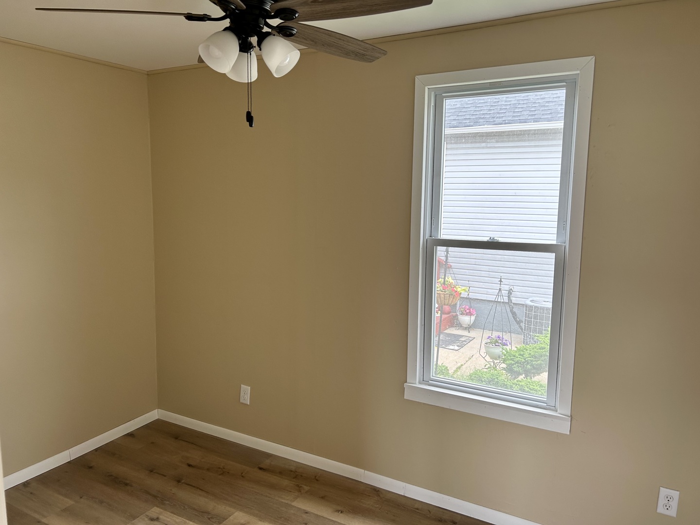 105 West 2nd Street Spring Valley, IL 61362 - Photo 12 of 18 a view of empty room with wooden floor and fan
