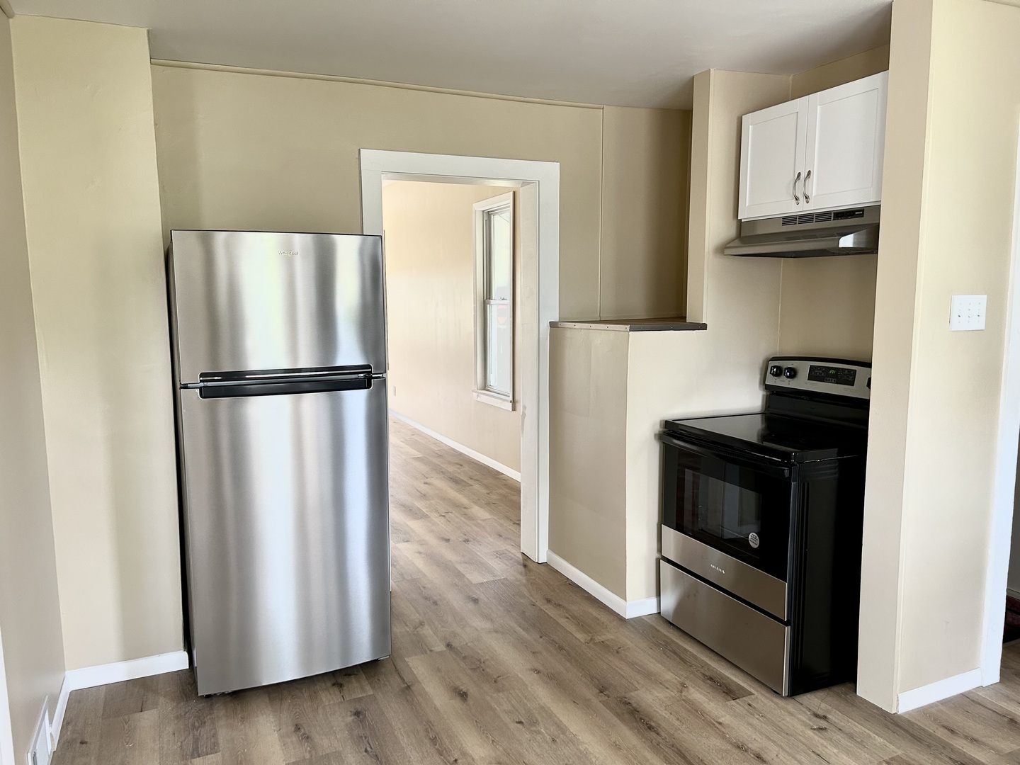 105 West 2nd Street Spring Valley, IL 61362 - Photo 8 of 18 a kitchen with a refrigerator and a stove