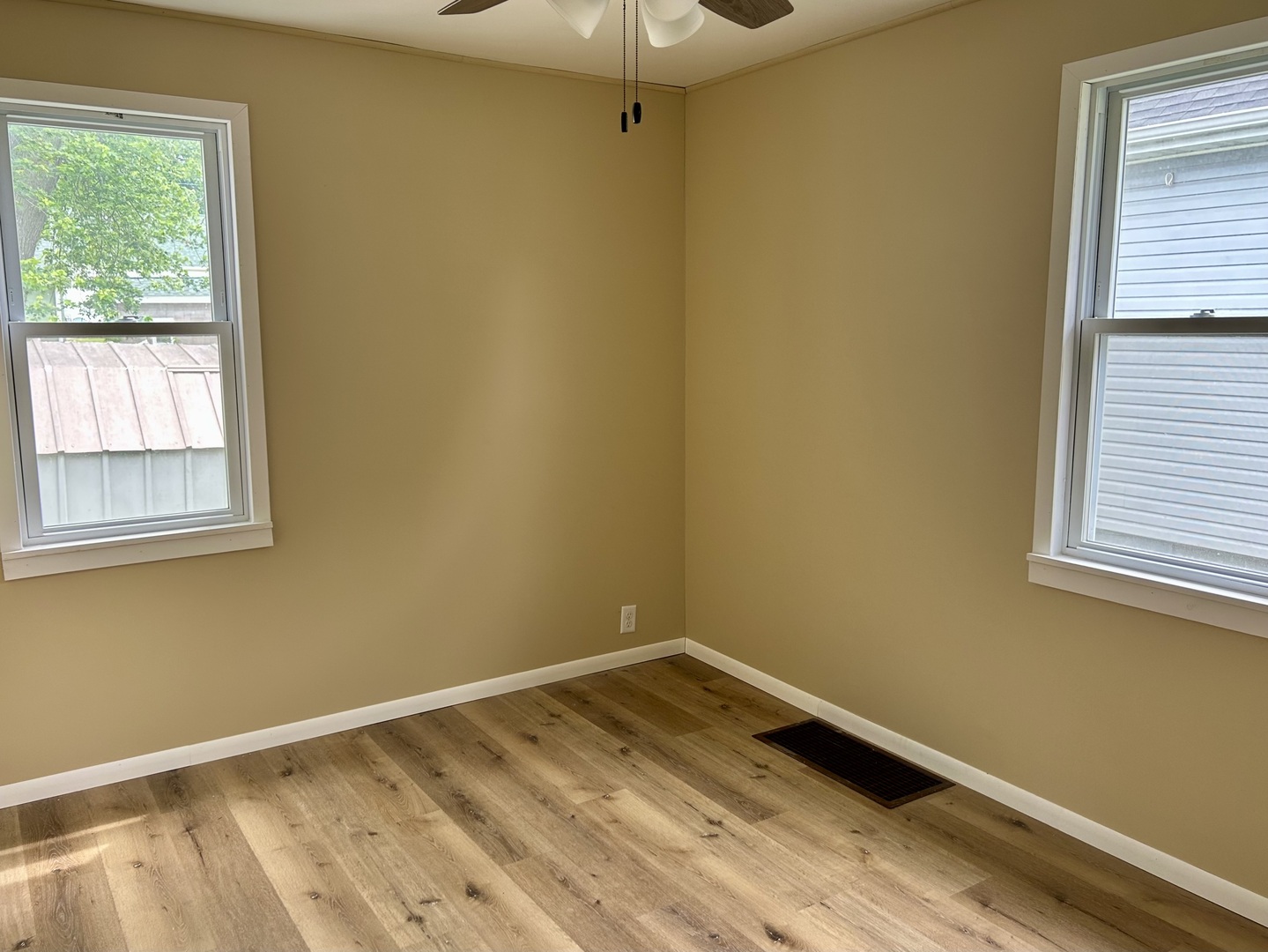 105 West 2nd Street Spring Valley, IL 61362 - Photo 9 of 18 a view of a room with wooden floor and fan