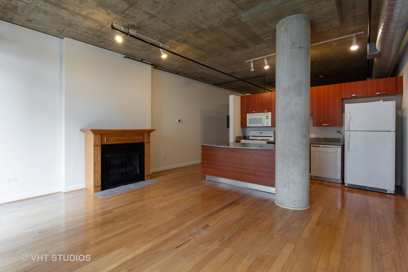 111 South Morgan Street, Unit 609 Chicago, IL 60607 - Photo 2 of 12 a view of kitchen with a sink and a fireplace