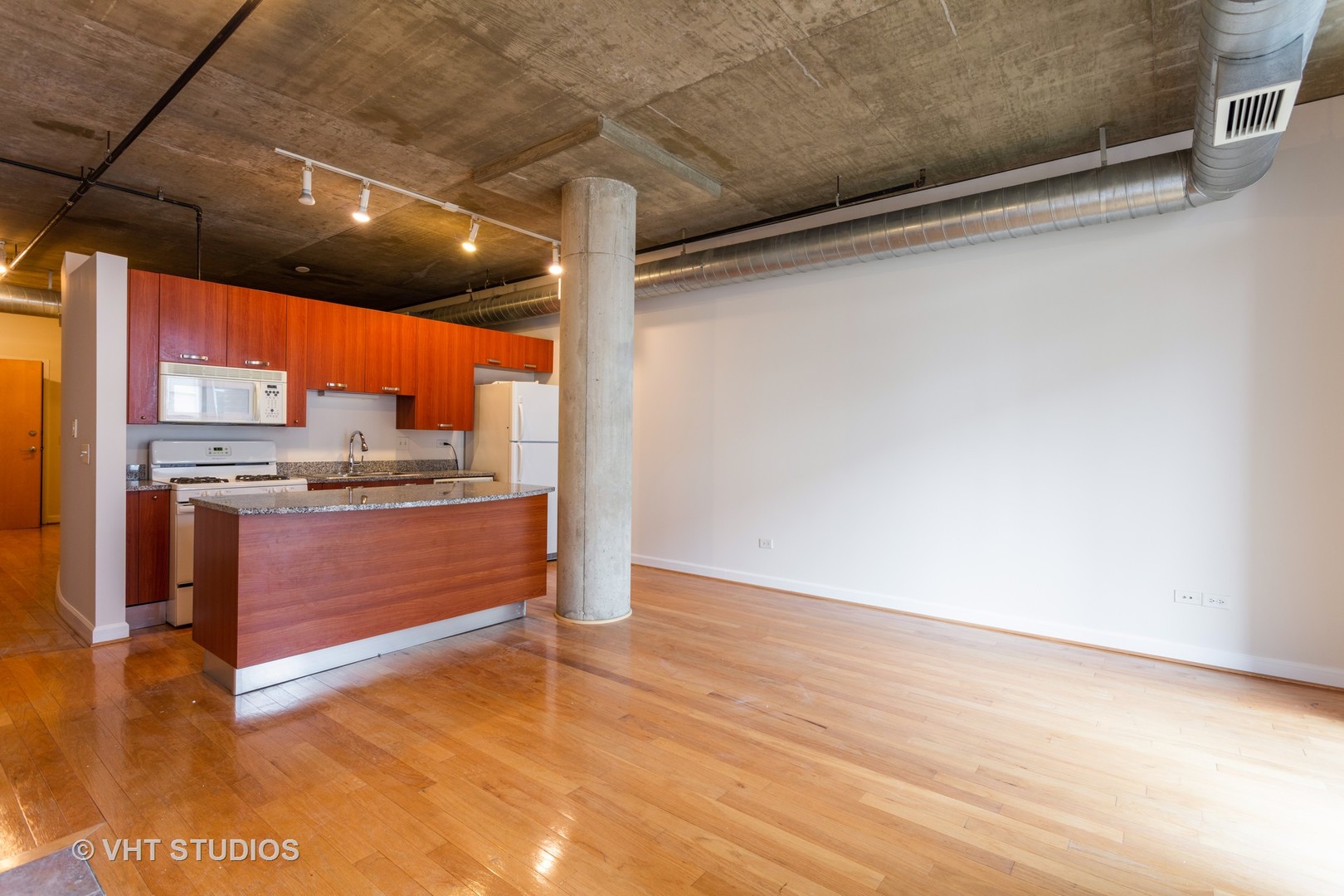 111 South Morgan Street, Unit 609 Chicago, IL 60607 - Photo 4 of 12 a view of kitchen with stainless steel appliances cabinets and wooden floor
