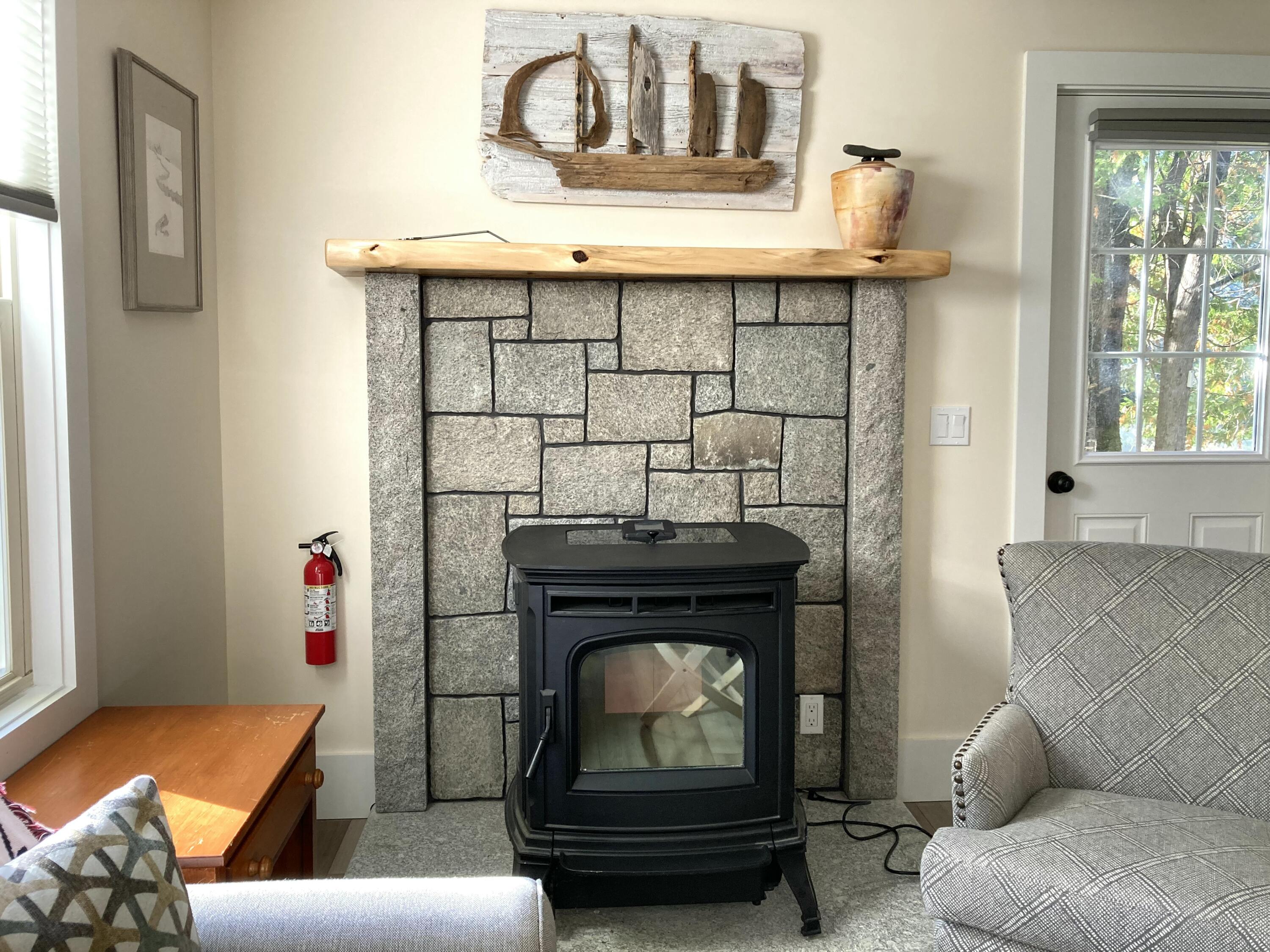 122 Cross Road Hancock, ME 04640 - Photo 16 of 45 Pellet stove, granite surround.