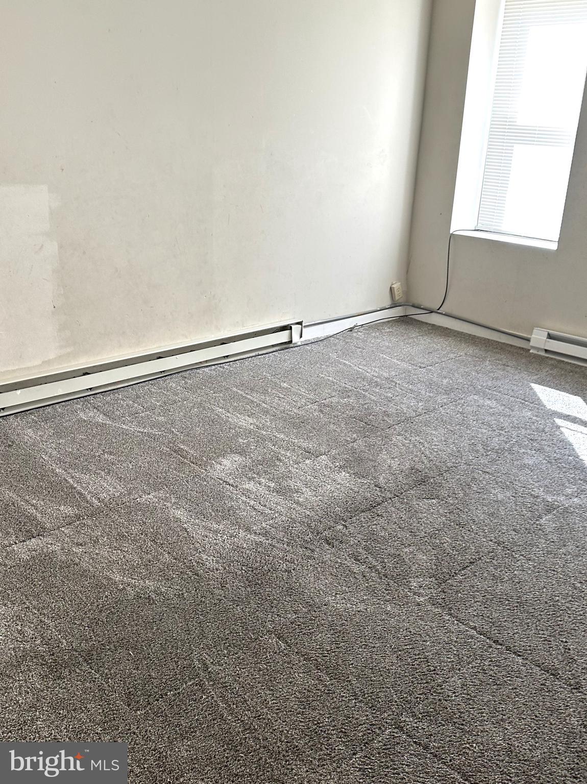 4934 Wynnefield Avenue, Unit 2 Philadelphia, PA 19131 - Photo 12 of 26 a view of an empty room with a window