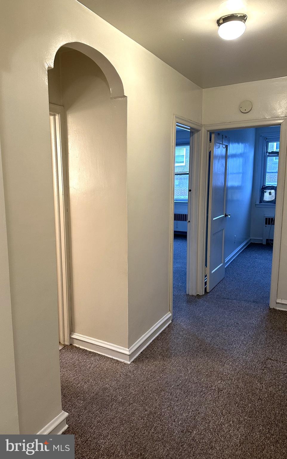 4934 Wynnefield Avenue, Unit 2 Philadelphia, PA 19131 - Photo 13 of 26 an empty room with closet and mirror