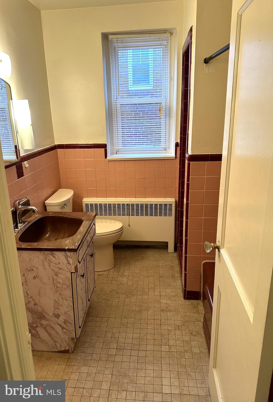 4934 Wynnefield Avenue, Unit 2 Philadelphia, PA 19131 - Photo 17 of 26 a bathroom with a sink and a mirror