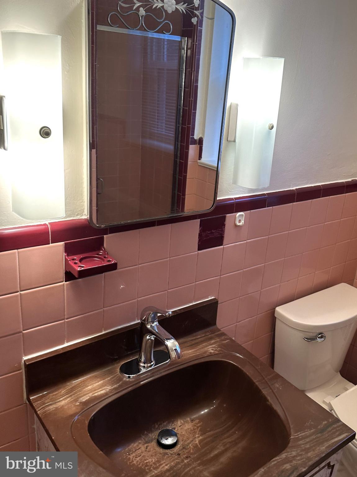 4934 Wynnefield Avenue, Unit 2 Philadelphia, PA 19131 - Photo 18 of 26 a bathroom with a sink and a toilet