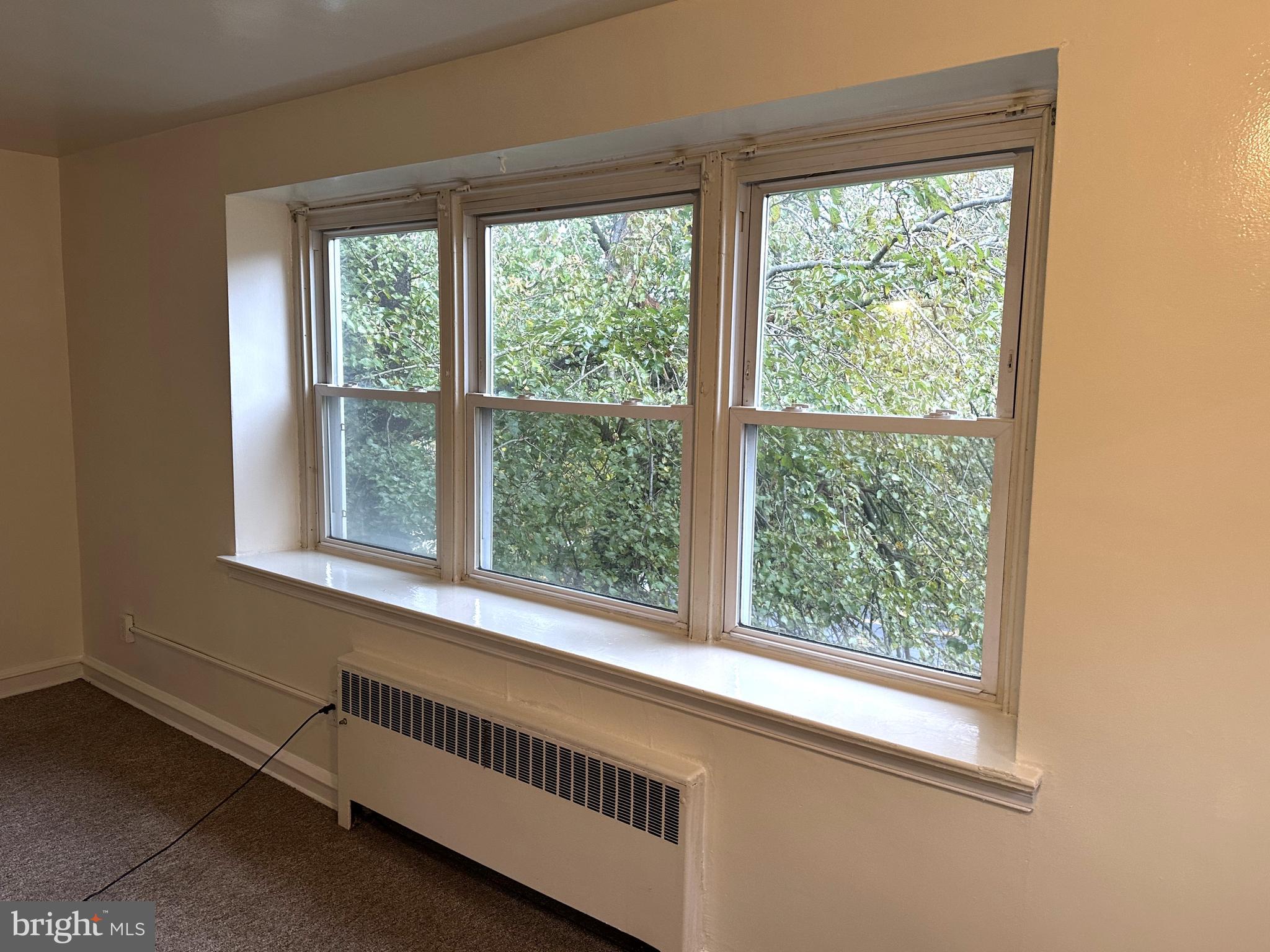 4934 Wynnefield Avenue, Unit 2 Philadelphia, PA 19131 - Photo 3 of 26 a view of a room that has a window and a ceiling fan
