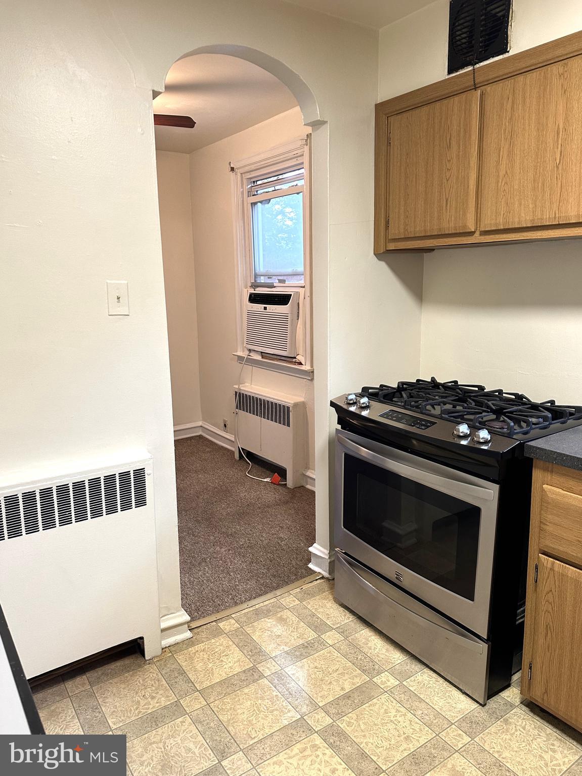 4934 Wynnefield Avenue, Unit 2 Philadelphia, PA 19131 - Photo 8 of 26 a kitchen with a stove and a microwave