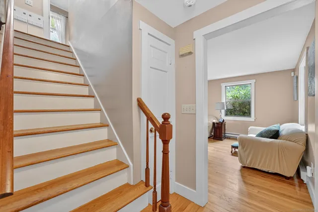a livingroom with wooden floor and a couch