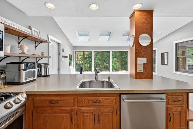 a kitchen with a sink and a window