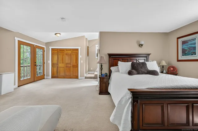 a bedroom with bed and a couch