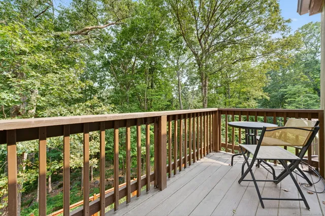 a view of a balcony with furniture