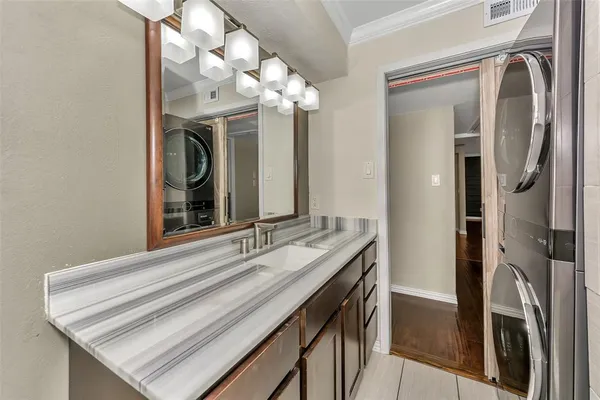 a bathroom with a sink a vanity and a mirror