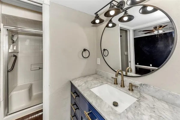 a bathroom with a sink double vanity and a mirror