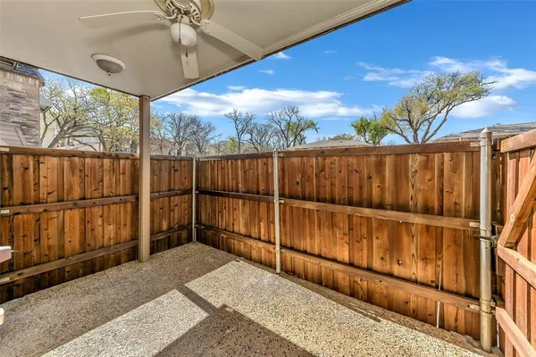 a view of outdoor space with wooden floor