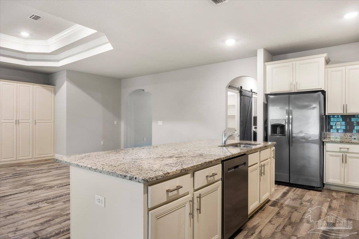 8056 Stream Ridge Road Pensacola, FL 32526 - Photo 23 of 66 a kitchen with stainless steel appliances granite countertop a sink stove and refrigerator