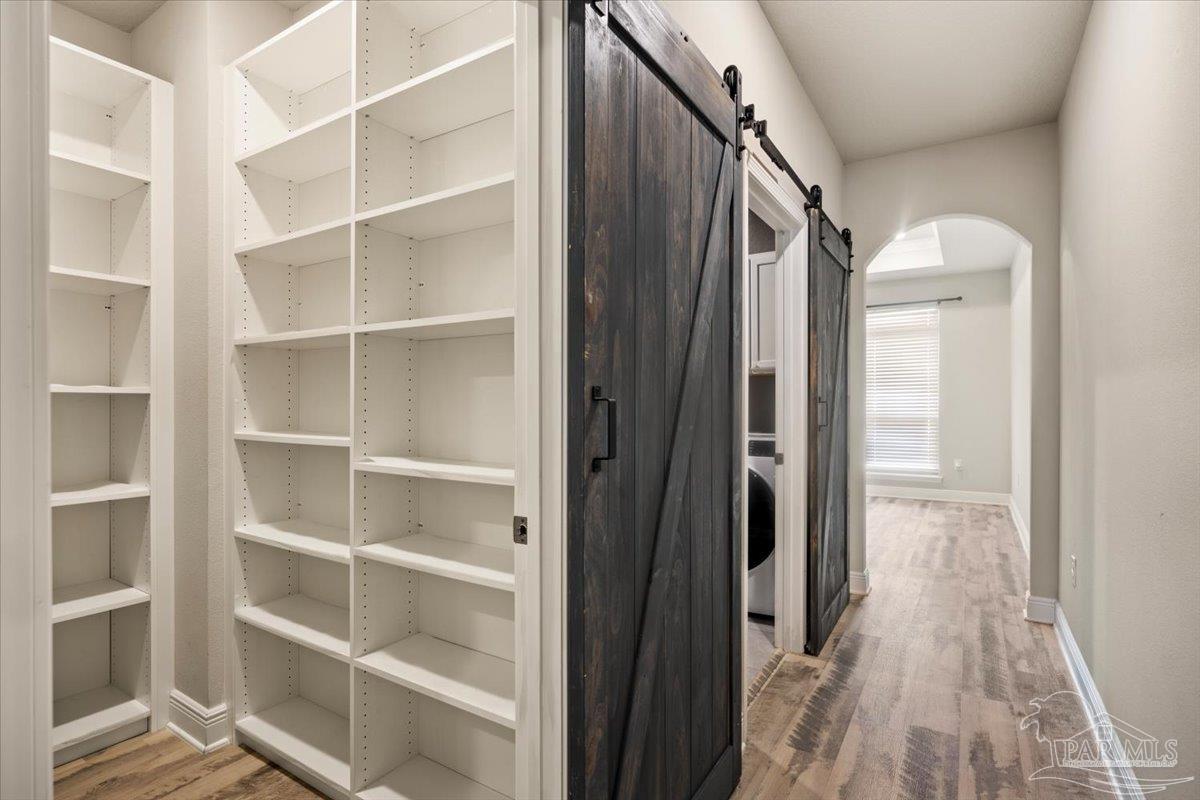 8056 Stream Ridge Road Pensacola, FL 32526 - Photo 28 of 66 a view of walk in closet with empty racks