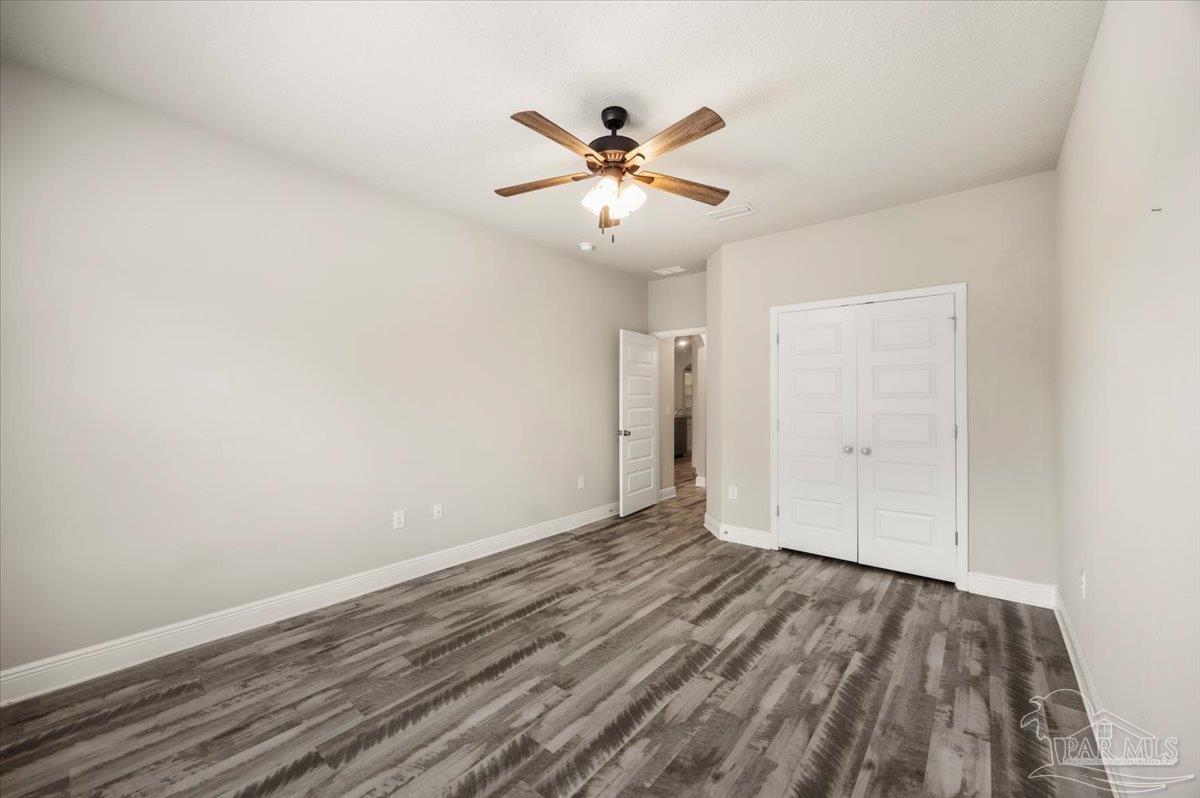 8056 Stream Ridge Road Pensacola, FL 32526 - Photo 36 of 66 wooden floor in an empty room with a window
