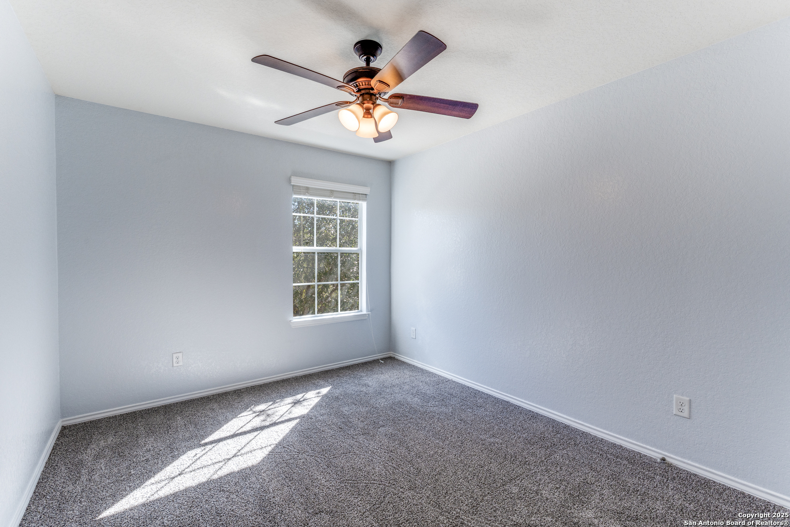455 Walnut Crest Schertz, TX 78154 - Photo 14 of 30 an empty room with windows and fan