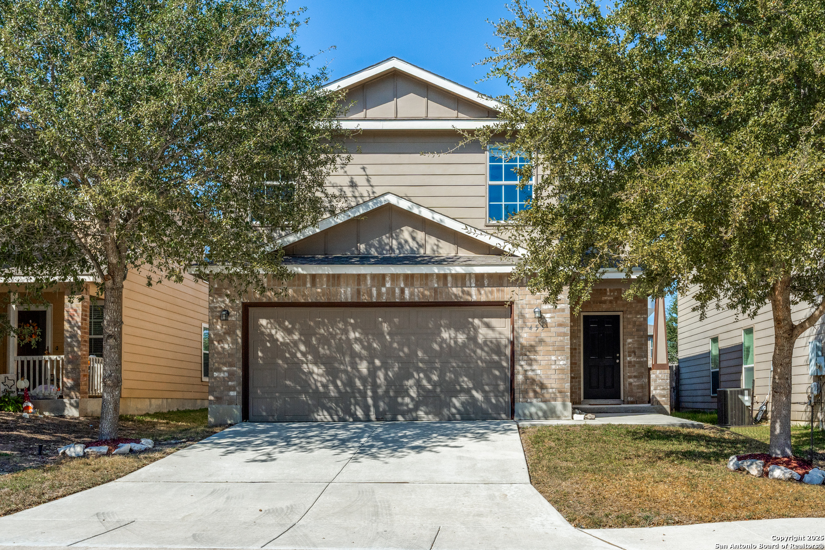 455 Walnut Crest Schertz, TX 78154 - Photo 2 of 30 a view of a house with large windows and a small yard