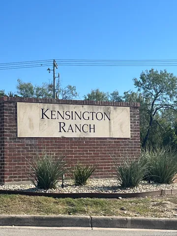 a sign board on the side of a building