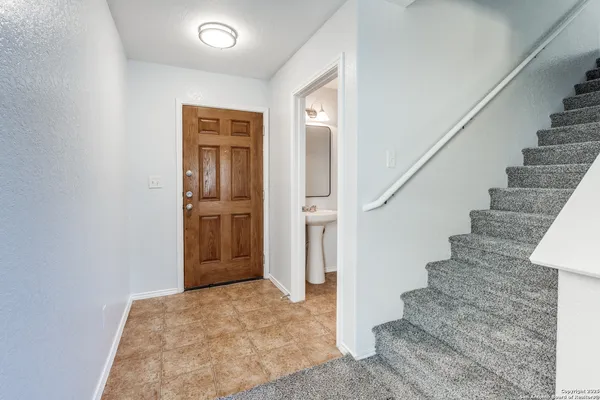 a view of entryway with wooden floor