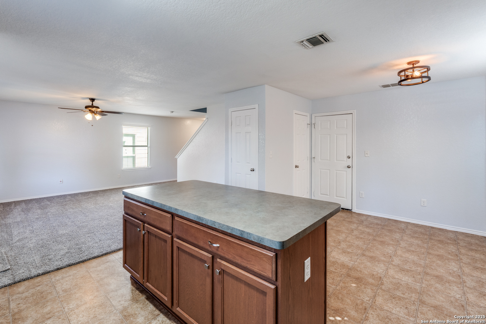 455 Walnut Crest Schertz, TX 78154 - Photo 9 of 30 a kitchen with a sink a vanity and chandelier