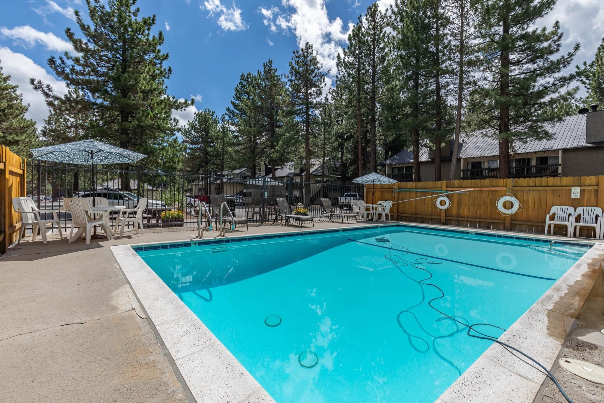 2289 Sierra Nevada Road, Unit G10 Mammoth Lakes, CA 93546 - Photo 21 of 23 Community pool with a patio area
