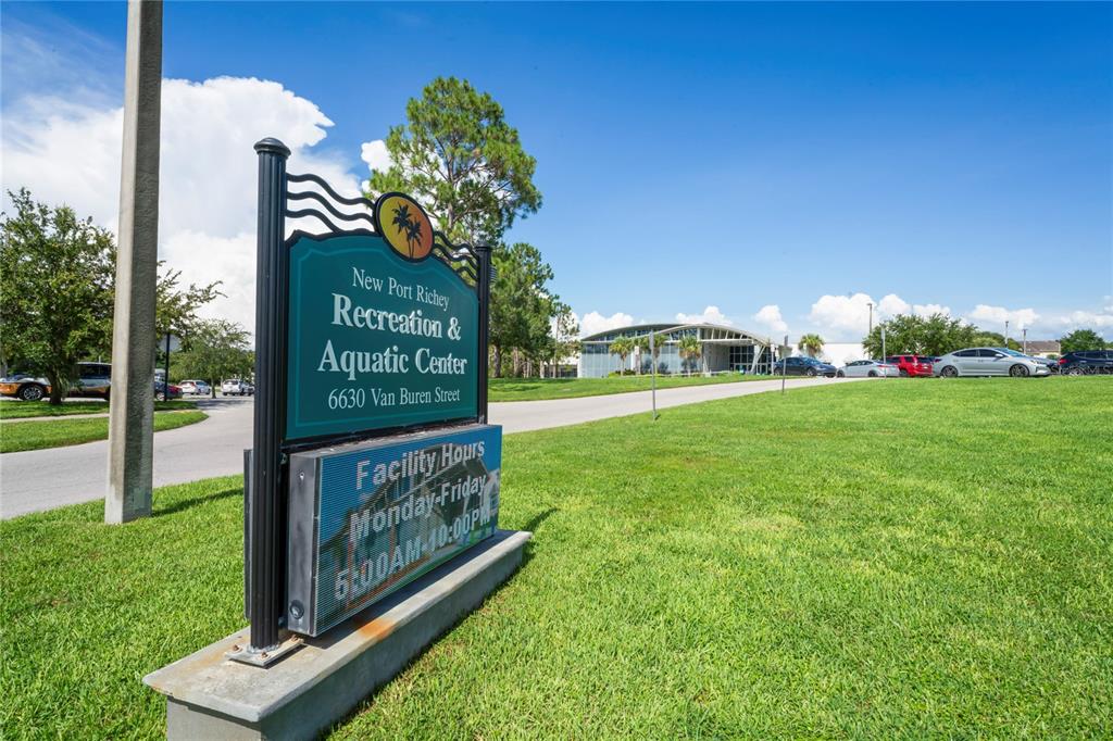 6724 Crossbow Lane New Port Richey, FL 34653 - Photo 24 of 26 a sign on the side of the building