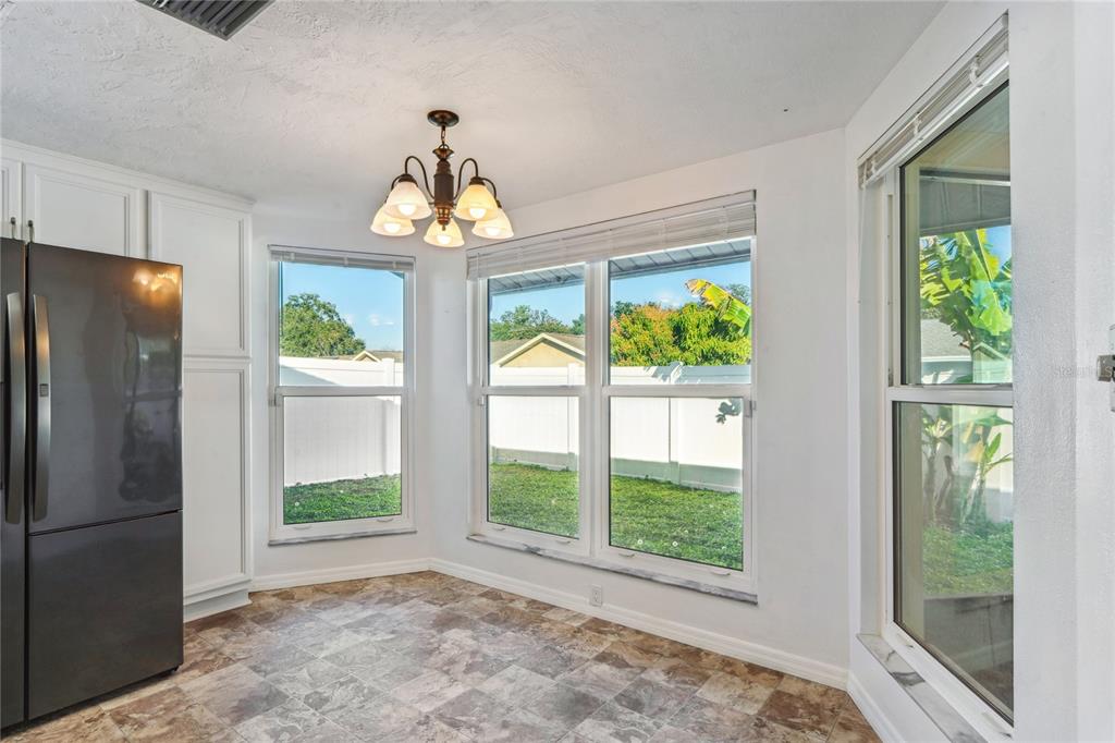 6724 Crossbow Lane New Port Richey, FL 34653 - Photo 8 of 26 a view of an entryway with wooden floor and windows