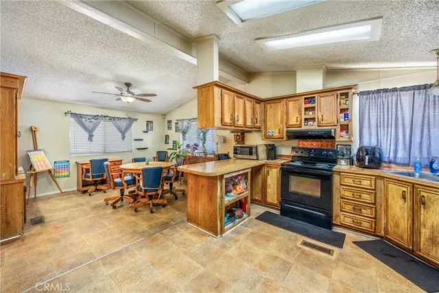 a kitchen with sink cabinets and window